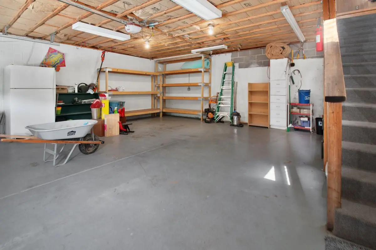 Residential garage interior with a plain concrete floor